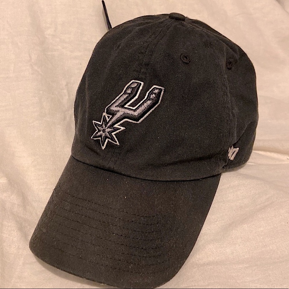 Black, lightly used Spurs baseball cap. Metal clasp adjustable back.